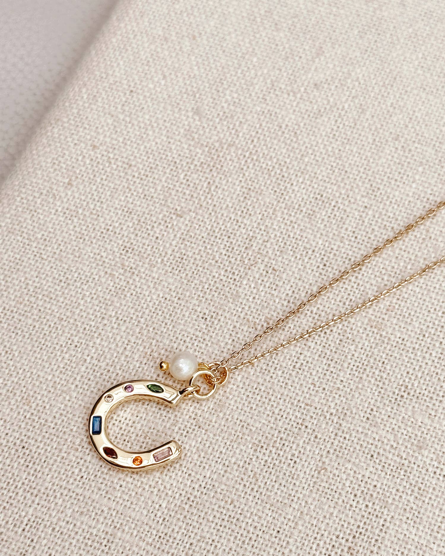 Gold Horseshoe Charm Necklace with Freshwater Pearl