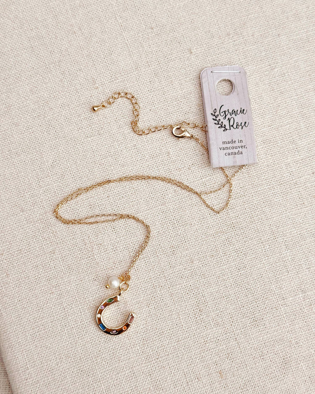 Gold Horseshoe Charm Necklace with Freshwater Pearl
