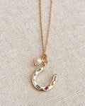 Gold Horseshoe Charm Necklace with Freshwater Pearl