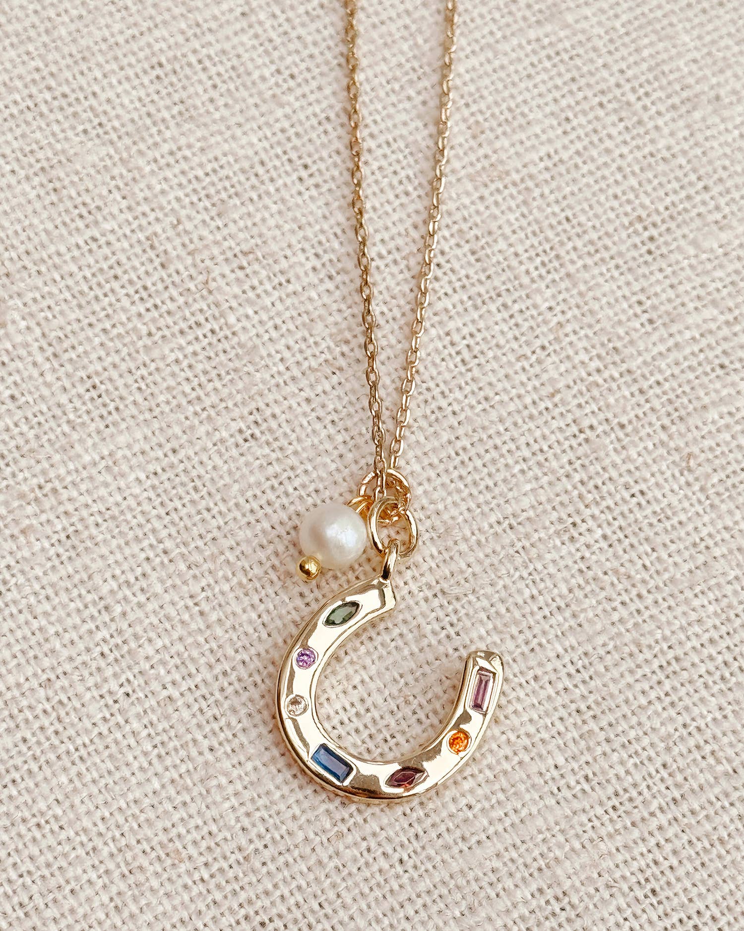 Gold Horseshoe Charm Necklace with Freshwater Pearl