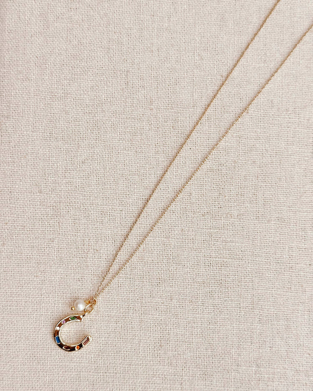 Gold Horseshoe Charm Necklace with Freshwater Pearl