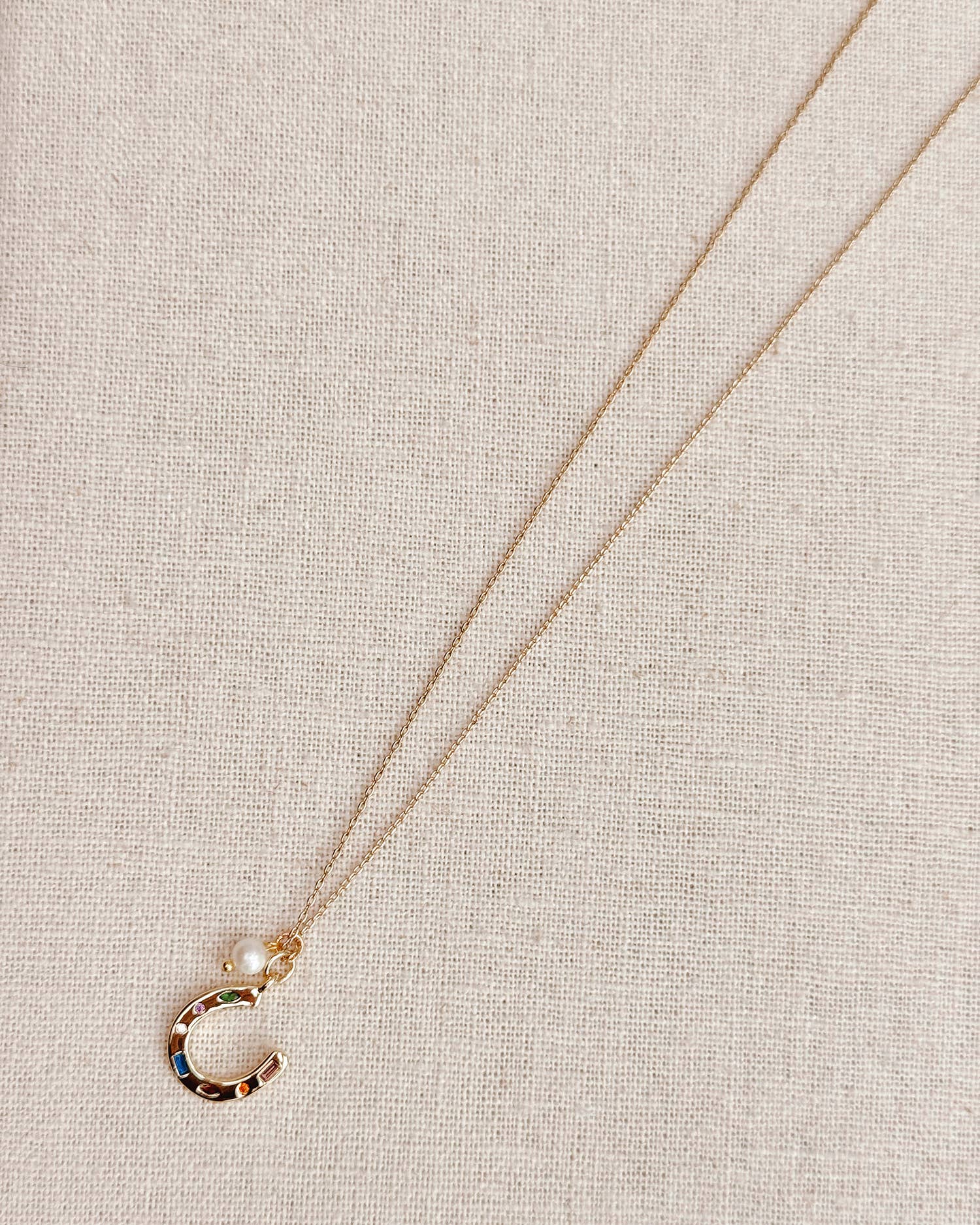 Gold Horseshoe Charm Necklace with Freshwater Pearl