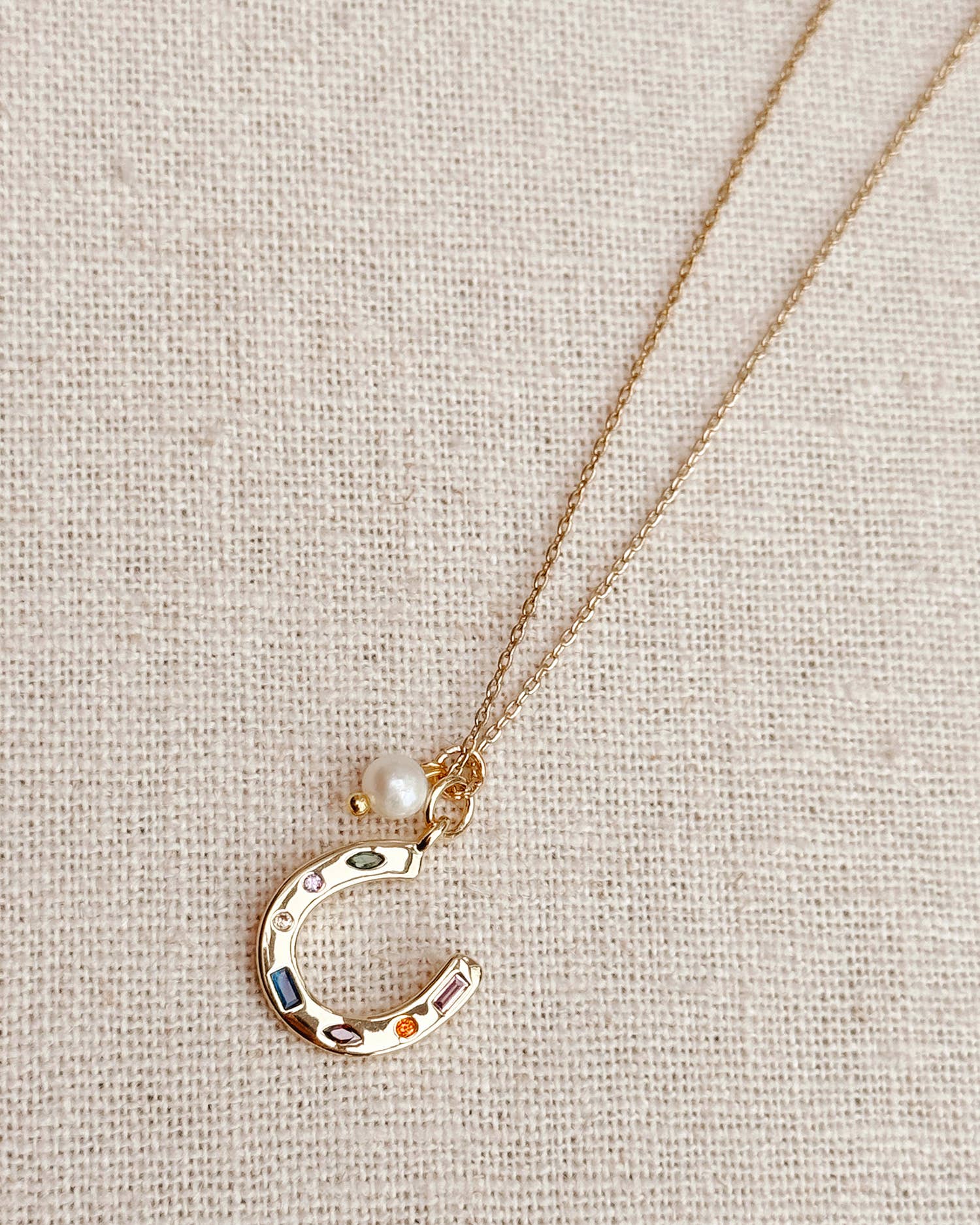 Gold Horseshoe Charm Necklace with Freshwater Pearl